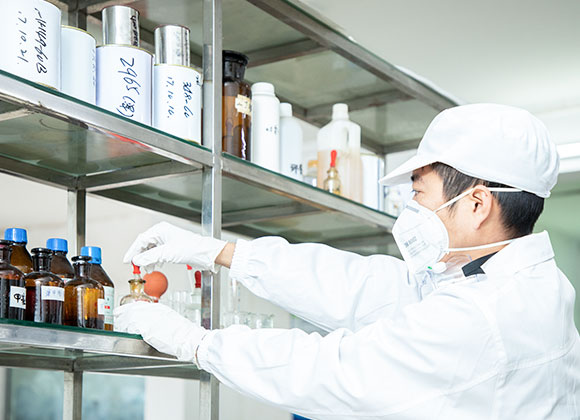 engineer testing paint in laboratory